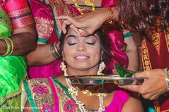 Indian bride receiving the bindi by Maharanis. Indian bride receiving the bindi by Maharanis.