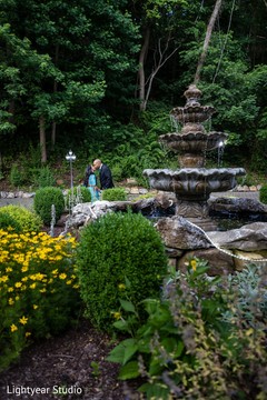 Indian couple kissing in the garden photo session. Indian couple kissing in the garden photo session.