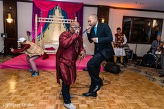 Indian groom singing at sangeet capture. Indian groom singing at sangeet capture.