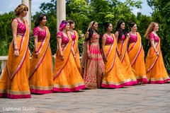 Indian bridesmaids with bride on their pink and orange lehengas. Indian bridesmaids with bride on their pink and orange lehengas.