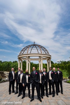 Indian groom with groomsmen outdoors photo session. Indian groom with groomsmen outdoors photo session.