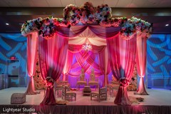 Indian wedding mandap pink lights, flowers and draping decor. Indian wedding mandap pink lights, flowers and draping decor.