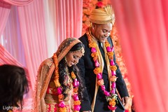 Indian couple with their ceremony ritual garlands. Indian couple with their ceremony ritual garlands.