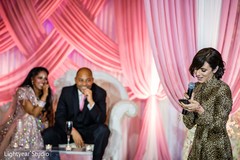 Indian wedding guest during reception speech. Indian wedding guest during reception speech.