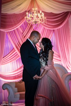 Indian couple on their reception outfits. Indian couple on their reception outfits.
