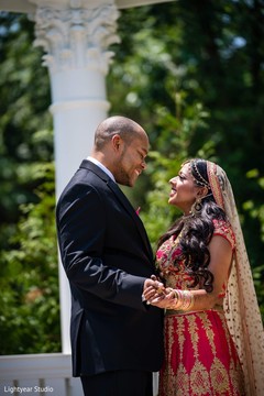 Indian bride and groom on their ceremony outfits. Indian bride and groom on their ceremony outfits.