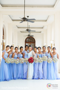 Maharani posing with her Indian bridesmaids holding bouquets. Maharani posing with her Indian bridesmaids holding bouquets.