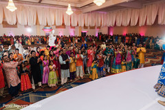 Indian relatives applauding the Indian couple on stage Indian relatives applauding the Indian couple on stage