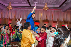 Indian groom up in Indian relatives shoulders Indian groom up in Indian relatives shoulders