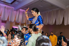 Indian bride up in Indian relatives shoulders Indian bride up in Indian relatives shoulders
