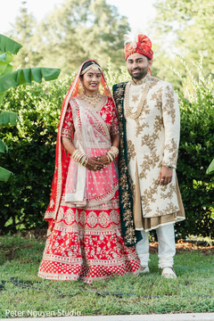 Indian bride and her Indian groom posing on the yard Indian bride and her Indian groom posing on the yard