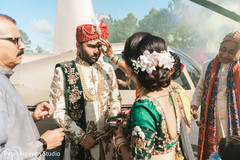 Maharani's female Indian relative greeting the Indian groom Maharani's female Indian relative greeting the Indian groom