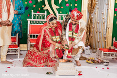 Indian couple doing the Agni ritual. Indian couple doing the Agni ritual.