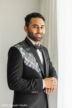 Raja in black tuxedo with blue details. Raja in black tuxedo with blue details.