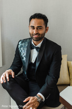 Indian groom wearing a tuxedo posing for picture. Indian groom wearing a tuxedo posing for picture.