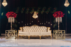 Stage decorated with chandeliers and flowers for photo session. Stage decorated with chandeliers and flowers for photo session.