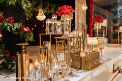 Golden decorations and roses in the venue. Golden decorations and roses in the venue.