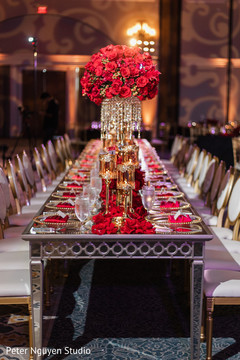Table center decoration made with red roses. Table center decoration made with red roses.