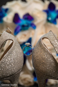 Detail of the Indian wedding shoes and ring. Detail of the Indian wedding shoes and ring.