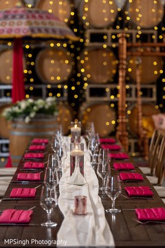 Pink and white Sangeet tablecloth decoration. Pink and white Sangeet tablecloth decoration.