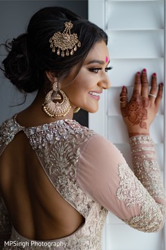 Indian bridal pink stones decorations on her back open anarkali. Indian bridal pink stones decorations on her back open anarkali.