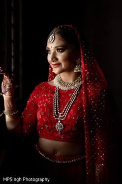 Maharani wearing her red and golden ceremony lehenga. Maharani wearing her red and golden ceremony lehenga.