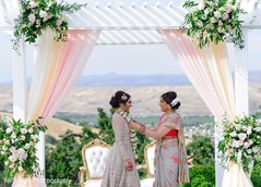 Indian bride and mother at ceremony mandap. Indian bride and mother at ceremony mandap.