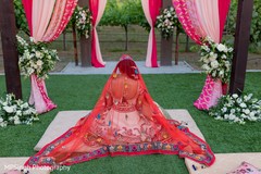 Indian bride wearing her ceremony red veil. Indian bride wearing her ceremony red veil.