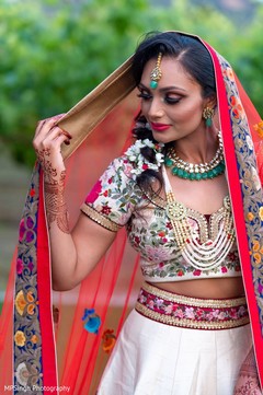 Indian bride holding her red ghoonghat. Indian bride holding her red ghoonghat.