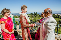 Indian groom being greeted by Maharani's parents. Indian groom being greeted by Maharani's parents.