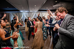 Indian bride dancing with guests. Indian bride dancing with guests.