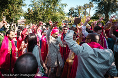 Indian groom dancing with his guests during baraat. Indian groom dancing with his guests during baraat.