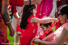 Children putting garlands on. Children putting garlands on.