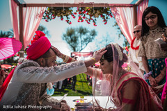 Indian couple putting hands on their foreheads. Indian couple putting hands on their foreheads.