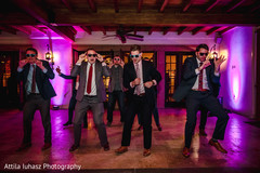 Indian groomsmen performing during reception. Indian groomsmen performing during reception.