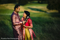 Indian bride and groom laughing during the photoshoot. Indian bride and groom laughing during the photoshoot.