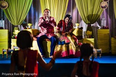 Indian bride and groom reacting during Sangeet. Indian bride and groom reacting during Sangeet.