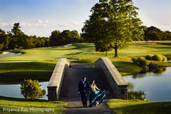 Indian groom and Maharani by the river during photos.