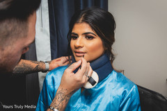 Indian bride getting her make up done Indian bride getting her make up done