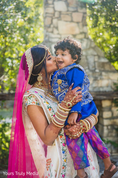 Maharani kissing and Indian kid on the cheek Maharani kissing and Indian kid on the cheek