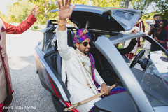 Indian groom waving during the Baraat Indian groom waving during the Baraat