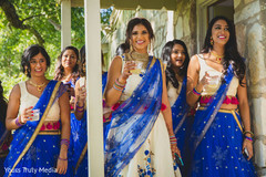 Indian bridesmaids sharing a drink with theIndian bride Indian bridesmaids sharing a drink with theIndian bride