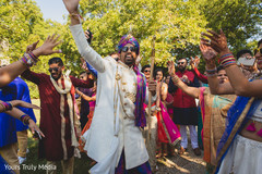Indian groom and Indian relatives dancing during the Baraat Indian groom and Indian relatives dancing during the Baraat