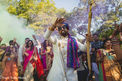 Indian groom and relatives dancing during the Baraat Indian groom and relatives dancing during the Baraat
