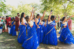Indian bridesmaids dancing at her arrival to the wedding yard Indian bridesmaids dancing at her arrival to the wedding yard