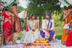 Indian couple looking at each other during the ceremony Indian couple looking at each other during the ceremony