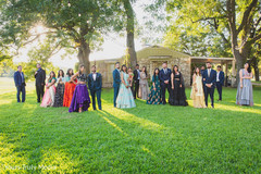 Newlywed Indian couple and their Indian wedding party posing Newlywed Indian couple and their Indian wedding party posing