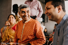 Indian relatives smiling during the Gaye Holud Indian relatives smiling during the Gaye Holud