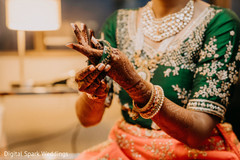 Maharani putting on her bracelets Maharani putting on her bracelets
