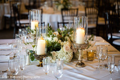 Indian wedding table white flowers centerpiece decor. Indian wedding table white flowers centerpiece decor.